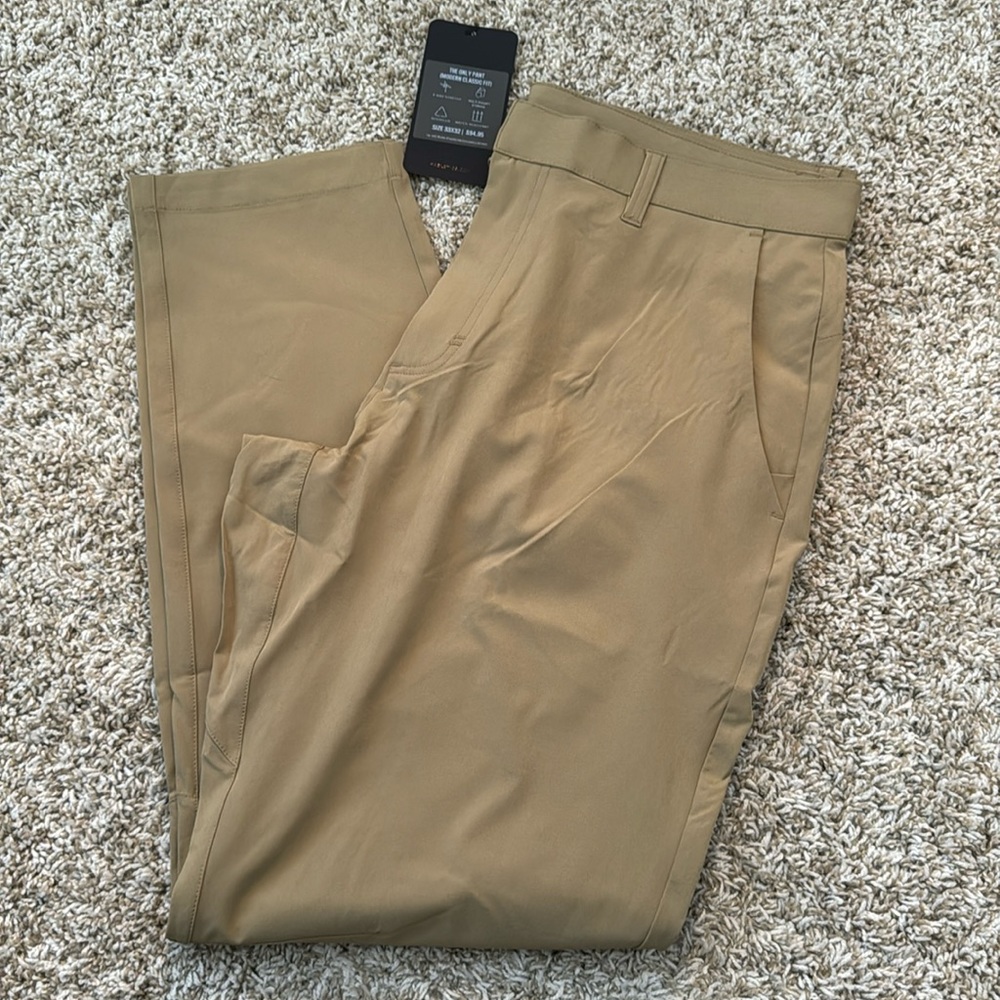 Fabletics “the only pant” khaki with hidden zip pockets in front and back